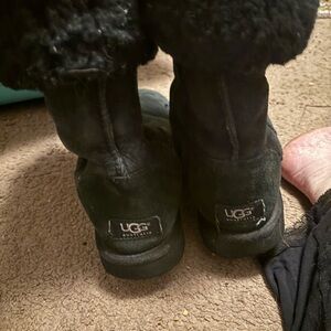 Tall black UGGS.  Very comfortable.   Can roll down for two looks